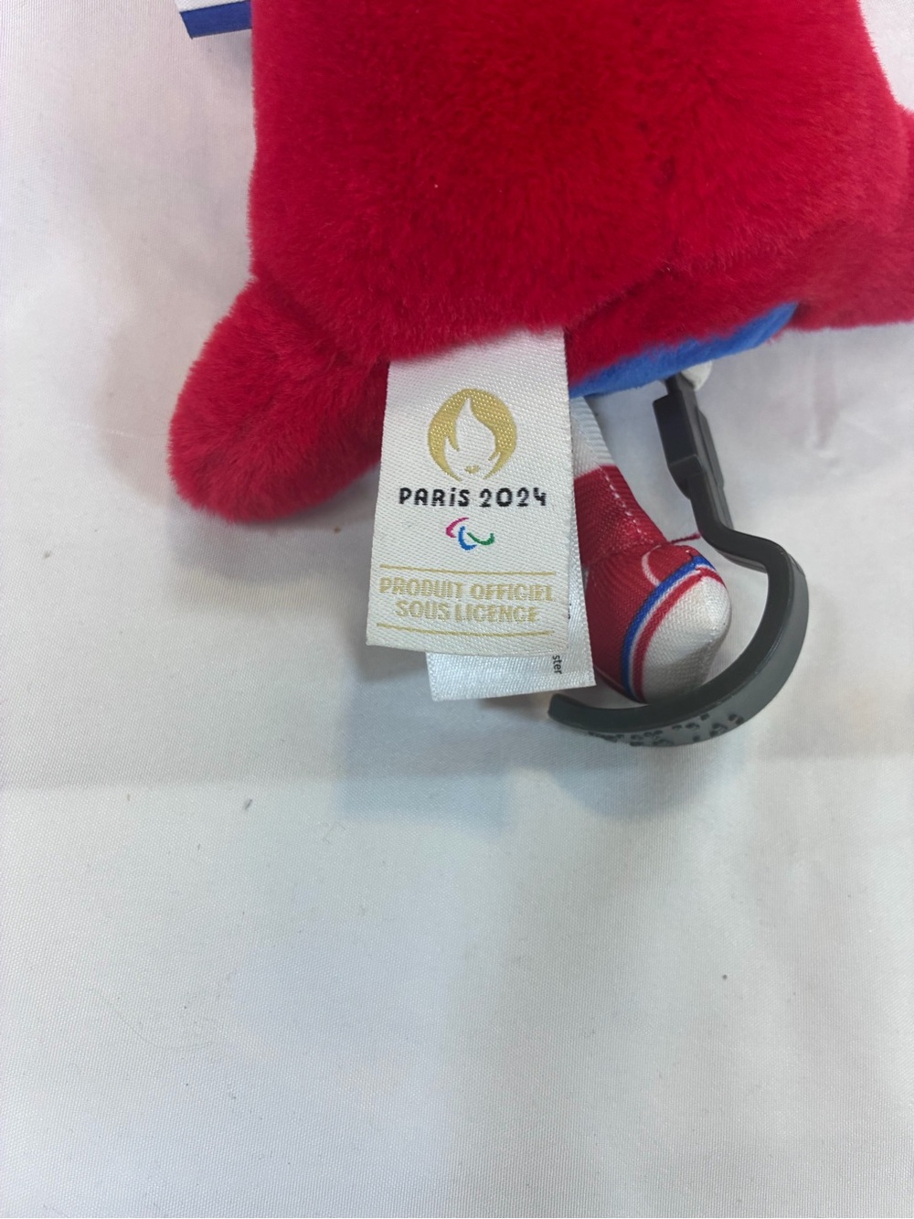 Red Paris 2024 Official Mascot Plush Keychain - Paralympics Prosthetic Leg - Picture 2 of 3